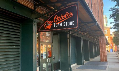 Orioles retail workers leaflet customers during union contract talks with Fanatics