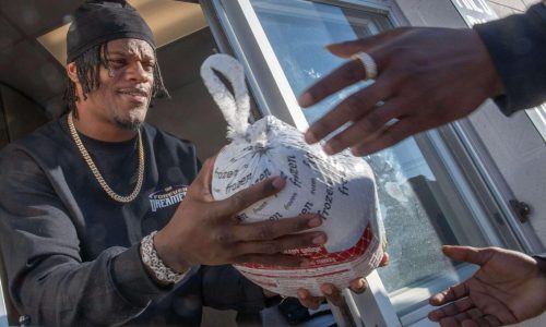 Ravens QB Lamar Jackson helps distribute turkeys for Carroll County Food Sunday in Westminster