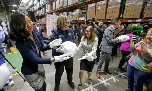 Greater Boston Food Bank passes 1,200 turkeys along ‘human chain’ to kick off holidays