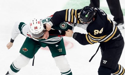 Wild battle back in Boston for overtime victory