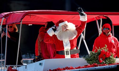 Santa delivers presents to South Boston kids by water taxi (Photos)