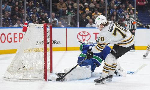 Bruins blow late lead, fall to Canucks, 3-2, in OT