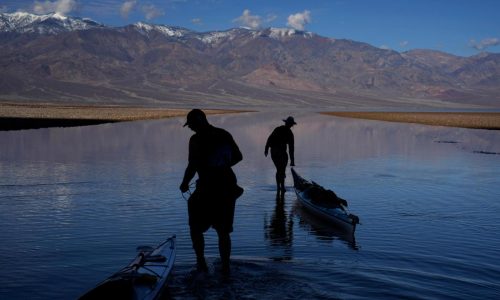 Kayakers paddle in Death Valley after rains replenish lake in one of Earth’s driest spots