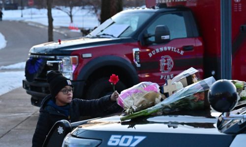 ‘Our community is broken’: Tears, prayers, hugs at vigil for fallen Burnsville officers, firefighter