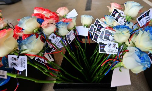 As police officer spouses prepare 4,000 blue and red roses for memorial service, ‘We’re thinking about them’