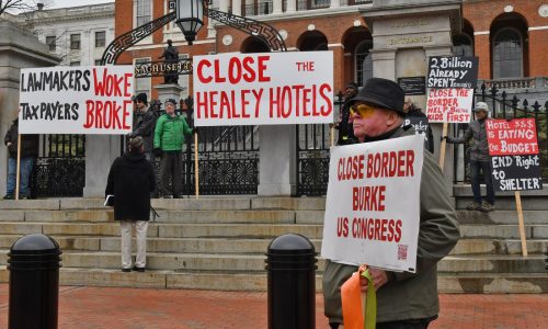 Protesters rally at State House in opposition to emergency shelter spending