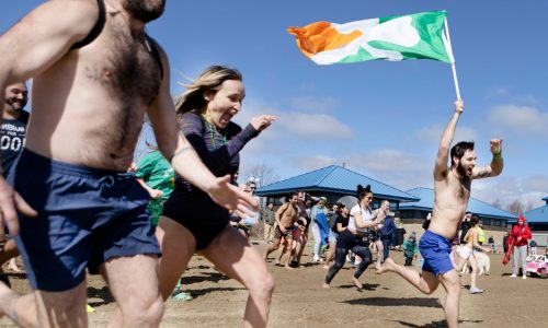 Shamrock shivers: Over 200 take the plunge to save Boston Harbor