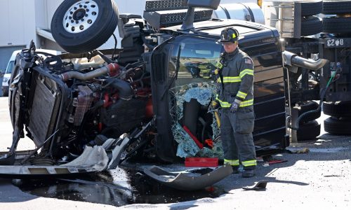 Tractor trailer rollover in front of Massachusetts State Police barracks in East Boston