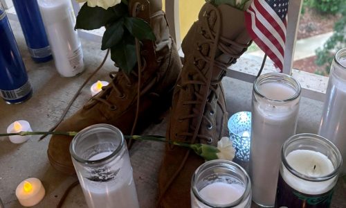 Questions and grief linger at the apartment door where a deputy killed a US airman