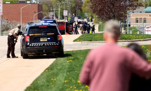 Investigators say student killed by police outside Wisconsin school had pointed pellet rifle