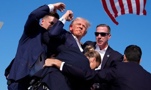Trump is injured but ‘fine’ after apparent assassination attempt leaves rally-goer and gunman dead