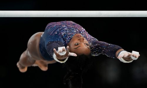 Simone Biles submits an original skill on uneven bars ahead of Paris Olympics