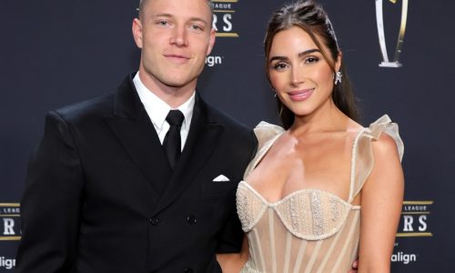 Olivia Culpo and Christian McCaffrey defend her wedding dress, which wasn’t supposed to ‘exude sex’