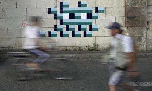 Mystery Paris street artist ‘Invader’ glues up new work to celebrate Olympics and delight fans