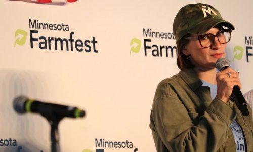 Tim Walz depicted as rural champion at Farmfest by Heidi Heitkamp and Peggy Flanagan