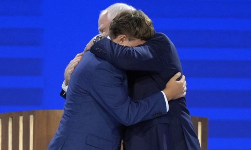 ‘That’s my dad!’: Gus Walz tearfully cheers on his father as he accepts Democratic VP nomination