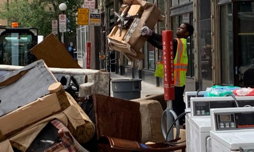 St. Paul Mayor Melvin Carter helps clear trash from Lowry basement as court appoints emergency receiver