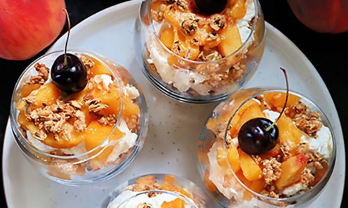 Peach and granola parfait is breakfast and dessert