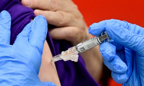When should I get flu and COVID shots? Experts disagree — but say get them however you can