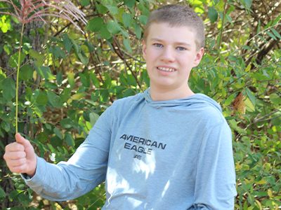 Active, friendly Shane loves to ride horses