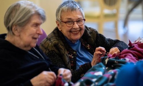 Residents of St. Paul senior center make blankets as gifts for Dorothy Day Center