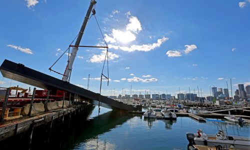 Crane in East Boston collapses, damaging moored boat, dock, police say