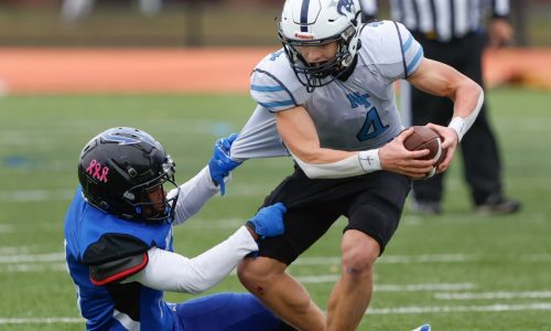 Randolph’s Mekhi White (183 yards) rushes by Nashoba Tech