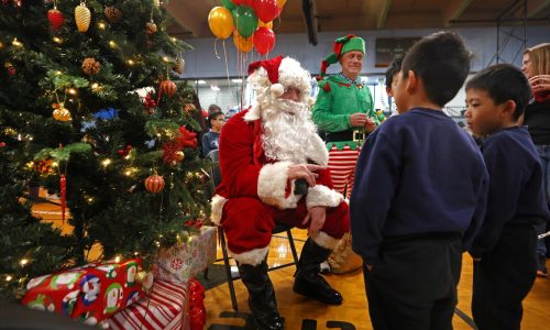 Holiday festivities kick into high gear at massive Wang YMCA of Chinatown party