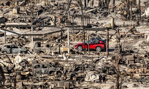 24 dead as fire crews try to corral Los Angeles blazes before winds return this week