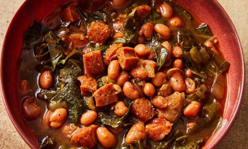 Flavorful chorizo brings meaty depth to a paprika pinto bean soup with collard greens