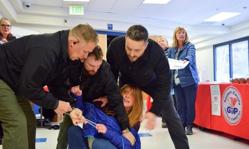 WATCH: Idaho town hall meeting turns chaotic after woman is forcibly removed for shouting at speakers
