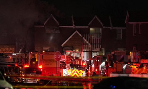 Plane with 2 aboard crashes in Philadelphia and sets multiple homes ablaze