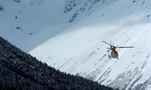 Experts and recovery teams hope to reach site of Alaska avalanche that buried 3 skiers