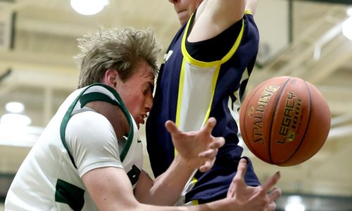 Marshfield plays airtight defense to edge Xaverian before large home crowd