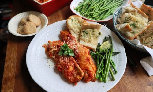 Cheesy homemade manicotti is the star of this budget dinner for four