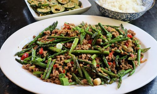 Pork and asparagus stir-fry with spicy cucumber salad