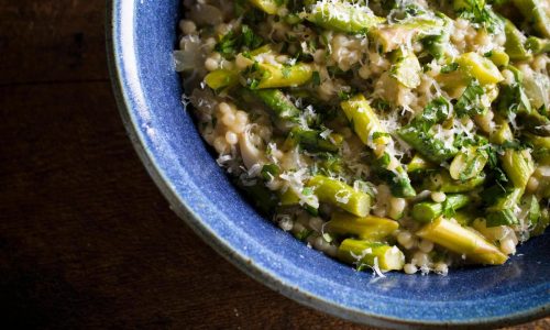 Couscous gets the risotto treatment in this creamy springtime recipe