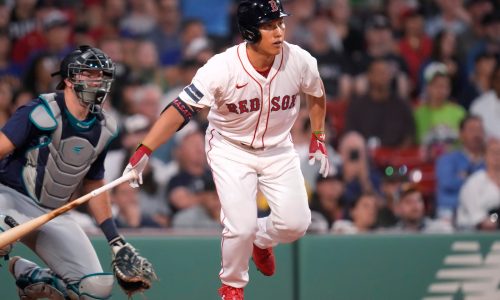 Red Sox outfielder Masataka Yoshida taking ground balls at first base