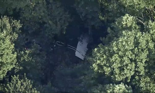 Skydiving plane goes off New Jersey runway and crashes into woods, sending at least 15 to hospital
