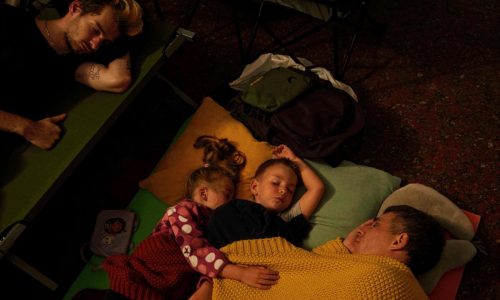 Ukraine’s capital buzzes during the day but it’s a battleground at night