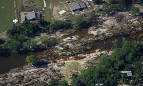 Searchers in helicopters and on horseback comb Texas flood debris for missing people
