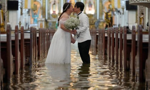 Photos: Filipino couple marry in typhoon-flooded church