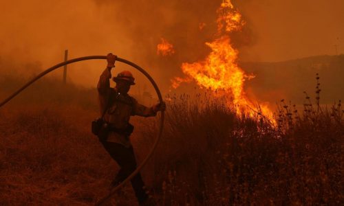Fast-growing brush fire forces thousands to evacuate north of Los Angeles