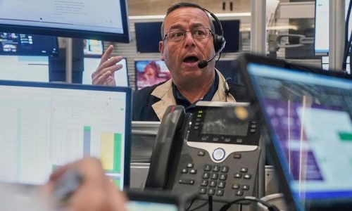 Stocks pull back from their latest all-time highs on Wall Street