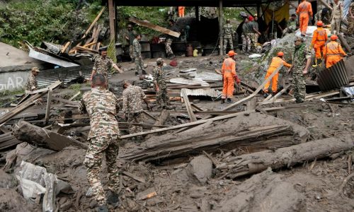 Flash floods triggered by torrential rains kill over 200 people in India and Pakistan