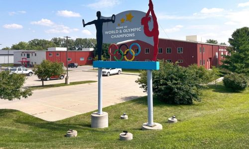 Years after abuse reports, ex-coach at renowned US gymnastics academy is arrested by FBI