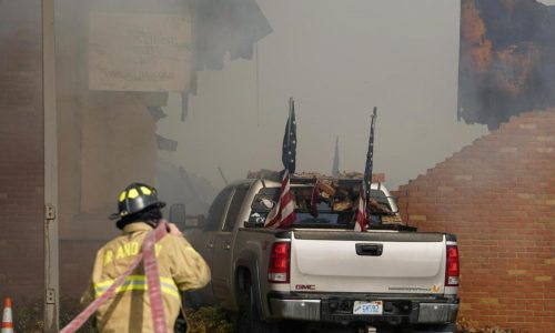 Police remain on scene at burned out Michigan church after shooting and fire leave 4 dead, 8 wounded