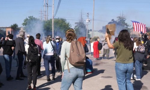 Federal agents fire chemicals as protesters try to block car at immigration site outside Chicago