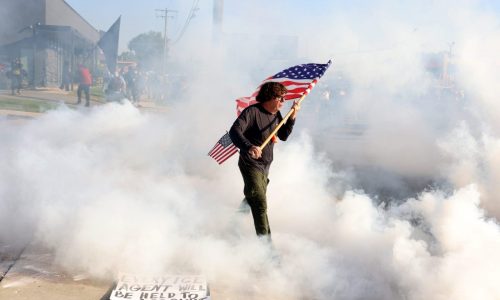 At suburban Chicago ICE facility, federal agents hurl tear gas and pepper spray at protesters blocking vans