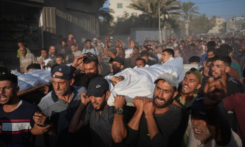 An Israeli security official says the transfer of aid into Gaza is halted after a Hamas ceasefire violation